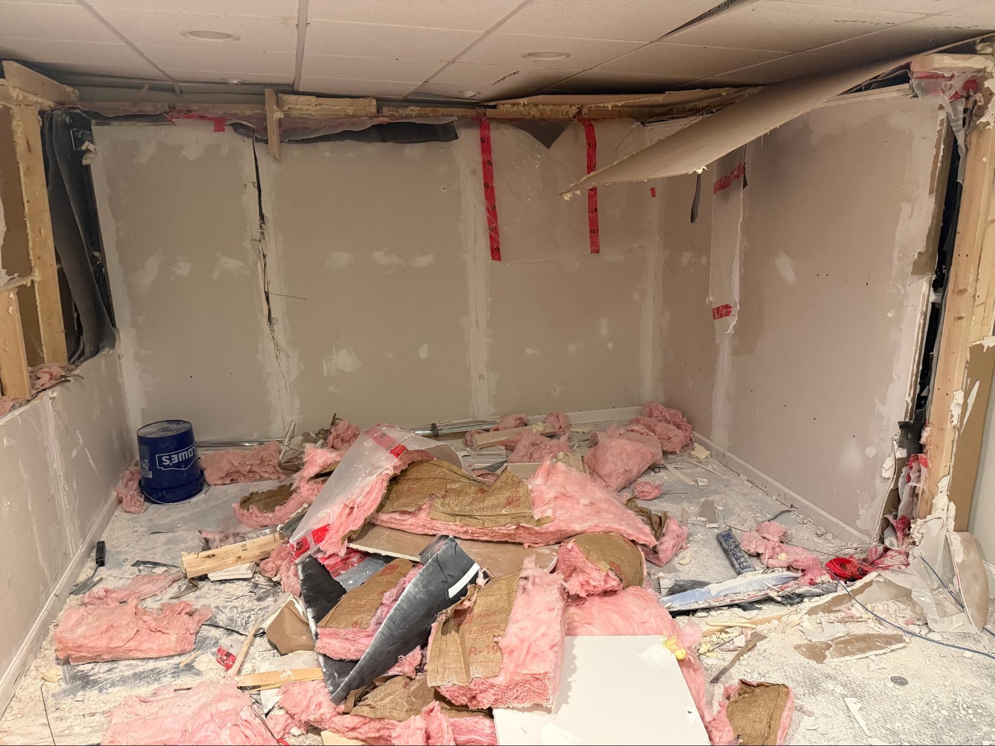 Room after demolition with debris on floor